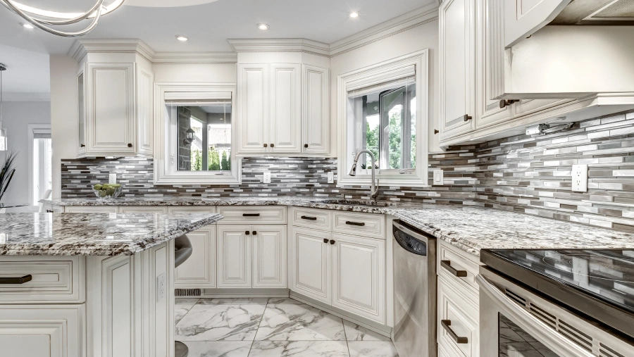 A kitchen with marble counter top